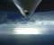 Airplane Above The Sea