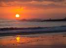 Surfing on a Sunset wallpaper